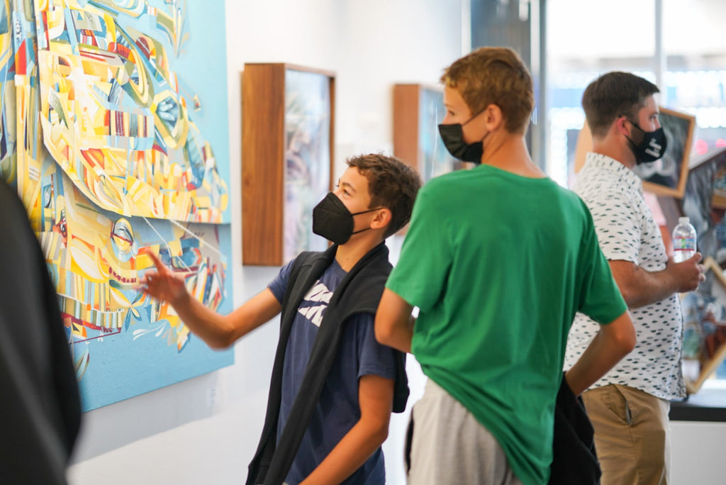 Photograph of people viewing artwork during the "Layers" opening reception featuring work by John Osgood and Trent Thompson at Voss Gallery, San Francisco on August 6, 2021.