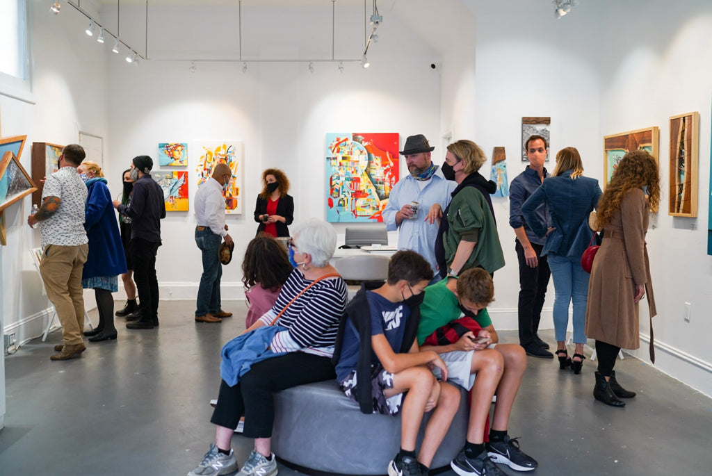 Photograph of people viewing artwork during the "Layers" opening reception featuring work by John Osgood and Trent Thompson at Voss Gallery, San Francisco on August 6, 2021.