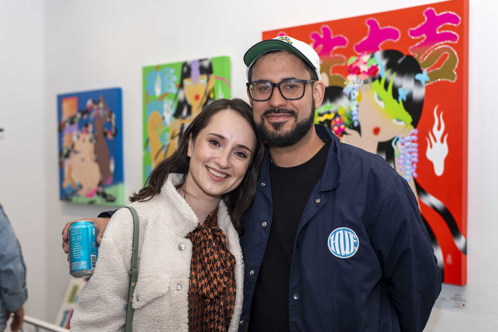 Photograph of a couple during Maya Fuji's "Kami" solo exhibition Opening Reception, May 27, 2022.