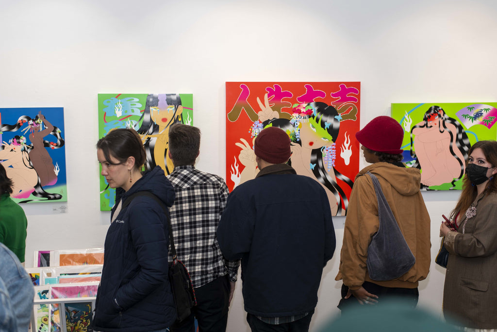 Photograph of people viewing artwork during Maya Fuji's "Kami" solo exhibition Opening Reception, May 27, 2022.