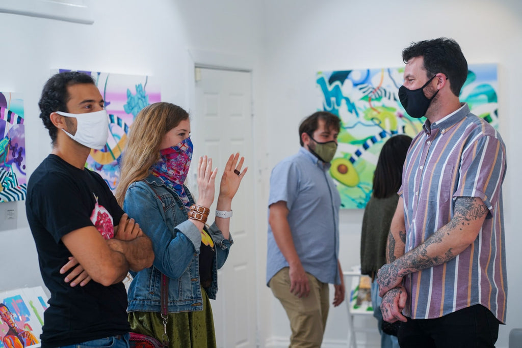 Photograph of people discussing during Joshua Nissen King's "Fruit of Another"solo exhibition Meet the Artist Event at Voss Gallery, San Francisco, September 12, 2020.