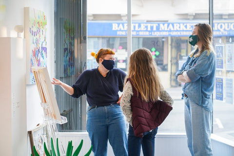 Photograph of three women talking during Joshua Nissen King's "Fruit of Another"solo exhibition Meet the Artist Event at Voss Gallery, San Francisco, September 12, 2020.