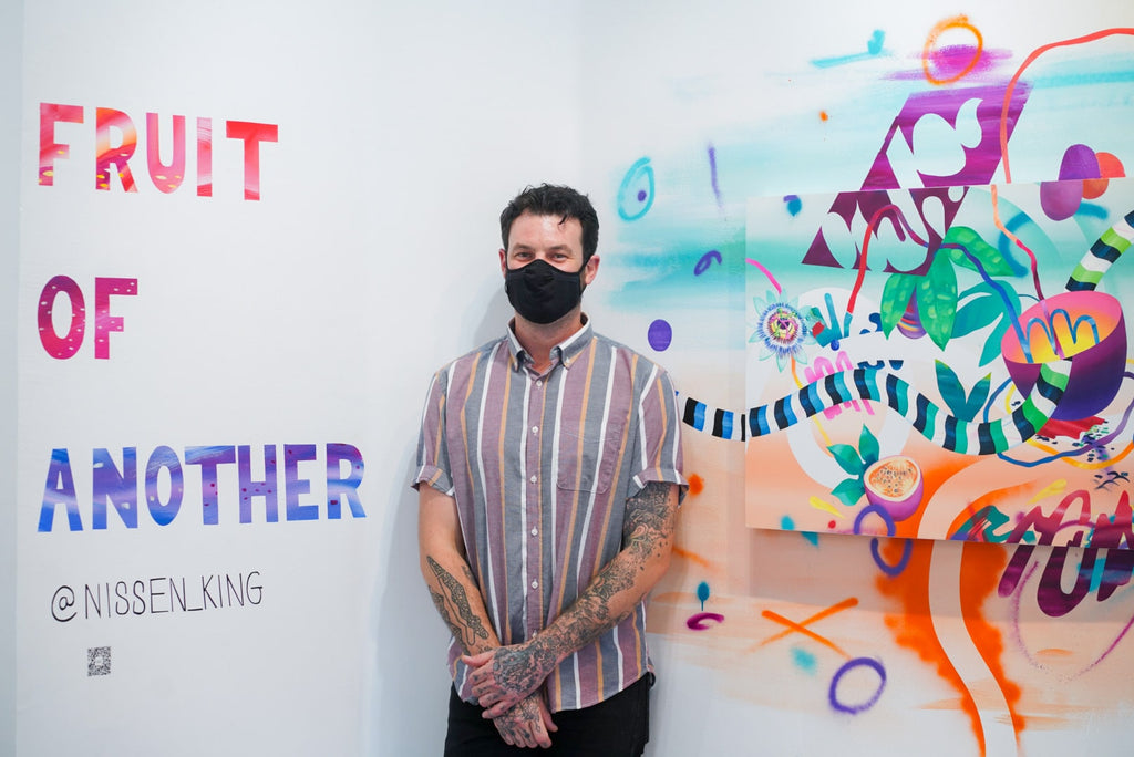 Photograph of artist wearing a face mask during Joshua Nissen King's "Fruit of Another"solo exhibition Meet the Artist Event at Voss Gallery, San Francisco, September 12, 2020.