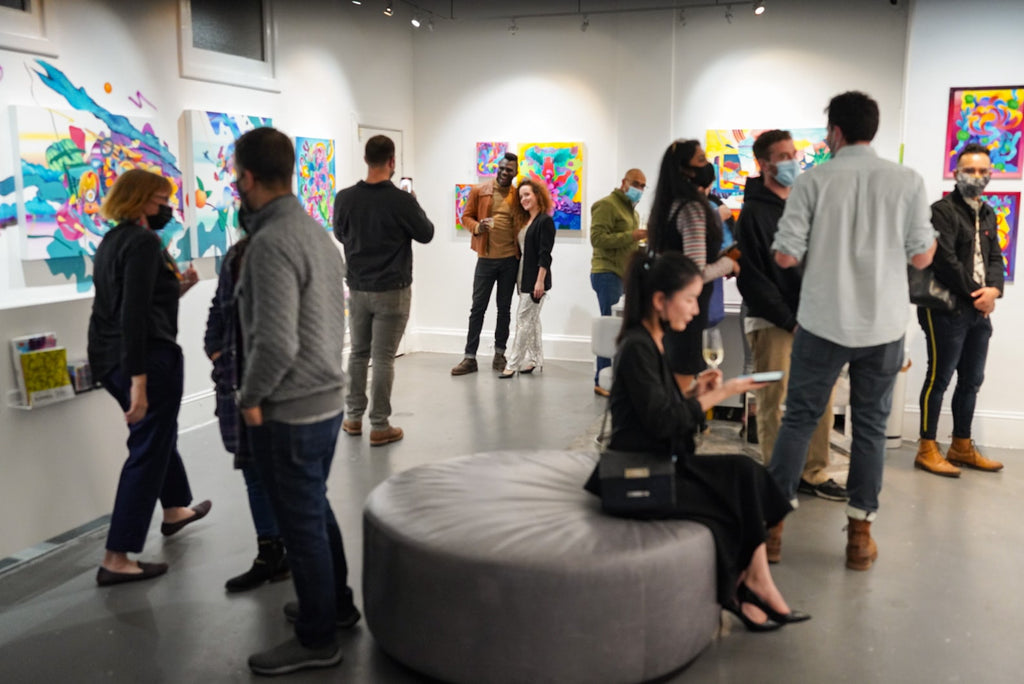 Photograph of attendees during Jennifer Banzaca & Joshua Nissen King's "Mirage" duo exhibition Opening Reception at Voss Gallery, October 22, 2021.