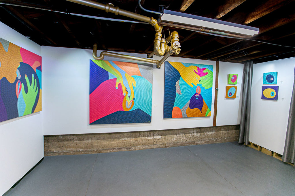 Natalia Lvova's "Confections" solo exhibition of erotic oil paintings was on view at Voss Gallery in San Francisco, February 15-29, 2020. Photograph of three paintings installed in the gallery's [The Down Low].