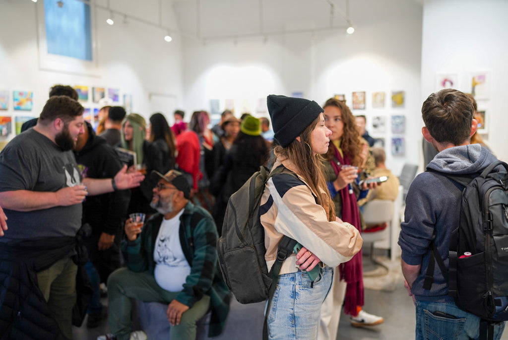 Photograph of attendees of the Opening Reception of the Postcards from Paradise Juried Group Exhibition at Voss Gallery in San Francisco, May 26, 2023.