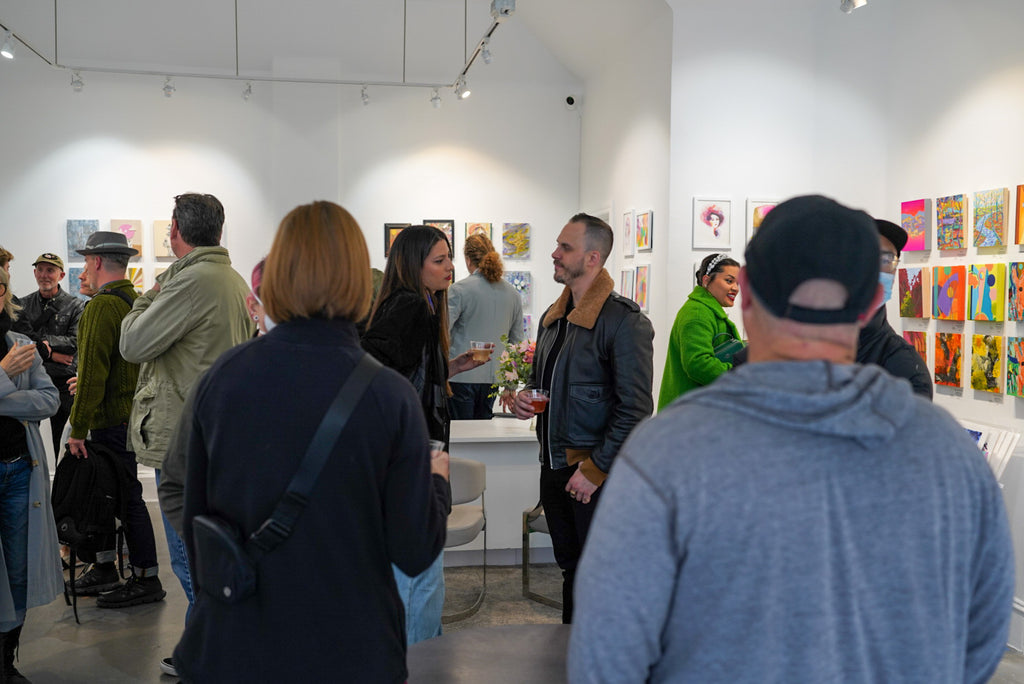 Photograph of visitors at the Postcards from Paradise Juried Group Exhibition Opening Reception at Voss Gallery in San Francisco, May 26, 2023.