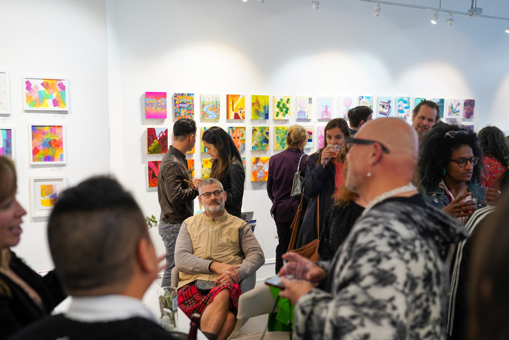 Photograph of attendees at the Opening Reception of the Postcards from Paradise Juried Group Exhibition at Voss Gallery in San Francisco, May 26, 2023.