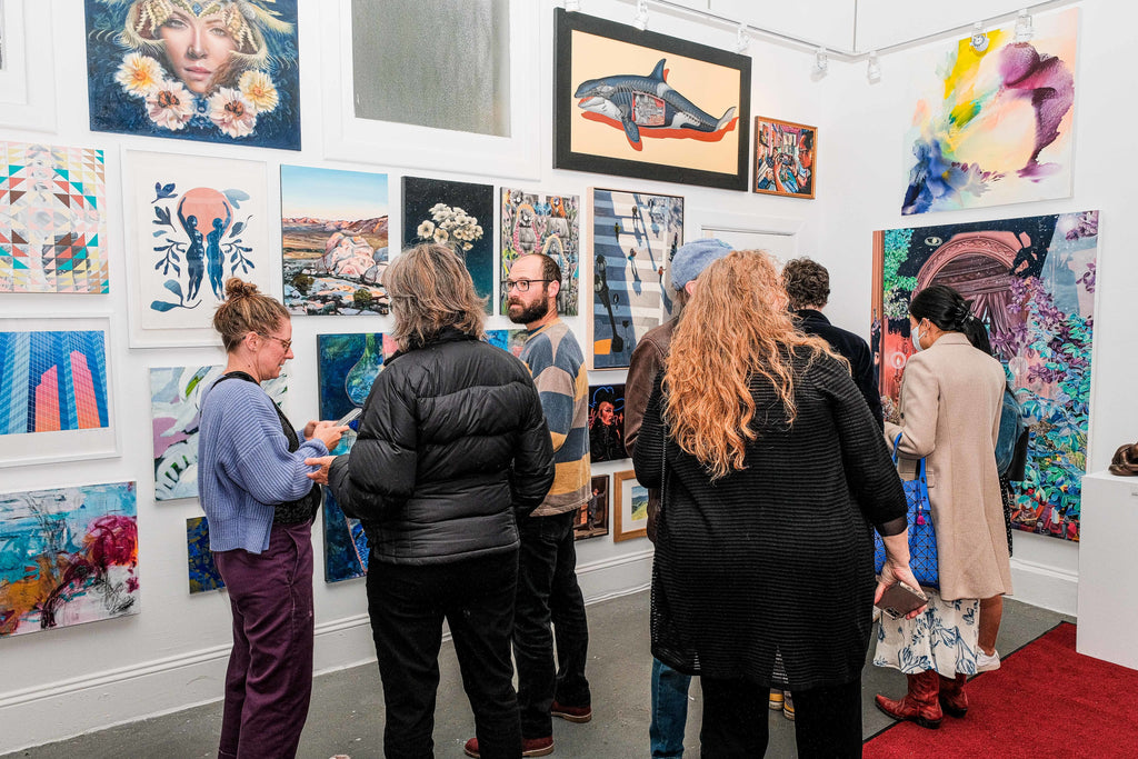 Photograph of people viewing paintings on the wall during the "Refusés of the Bay" Group Exhibition Opening Reception at Voss Gallery, San Francisco, September 29, 2023.