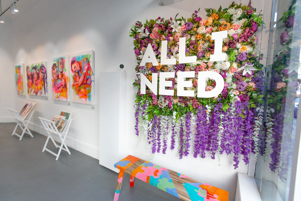 All I Need sign promoting The Tracy Piper's "All I Need" solo exhibition of vibrant figurative paintings was showing at Voss Gallery in San Francisco, February 7-29, 2020.