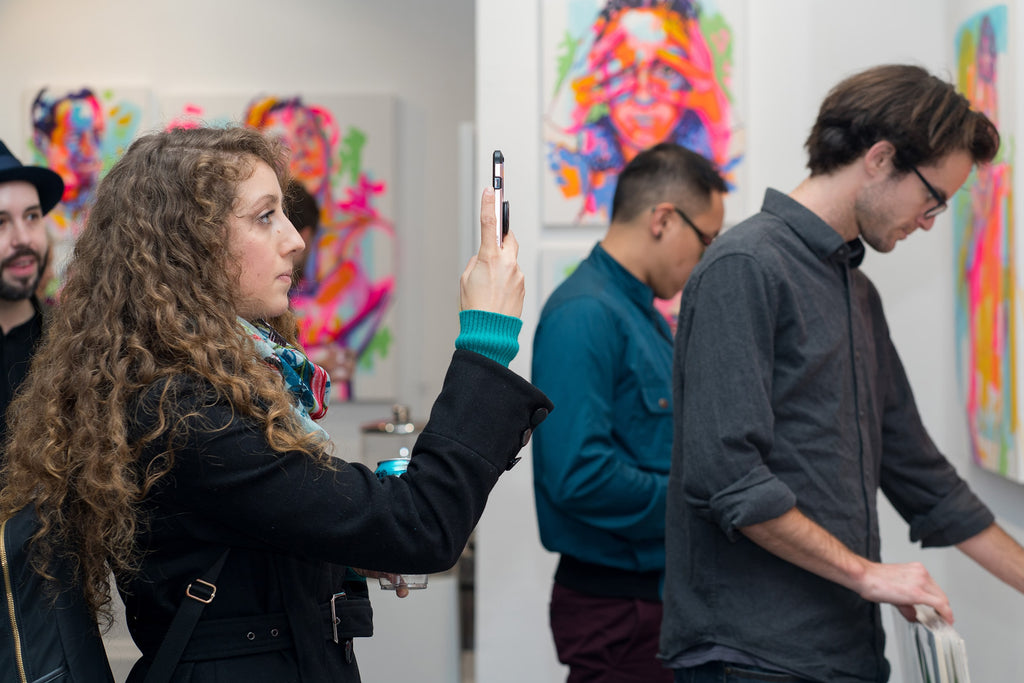 Collectors attending the Opening Reception of The Tracy Piper's "All I Need" solo exhibition of vibrant figurative paintings on view at Voss Gallery in San Francisco, February 7-29, 2020.