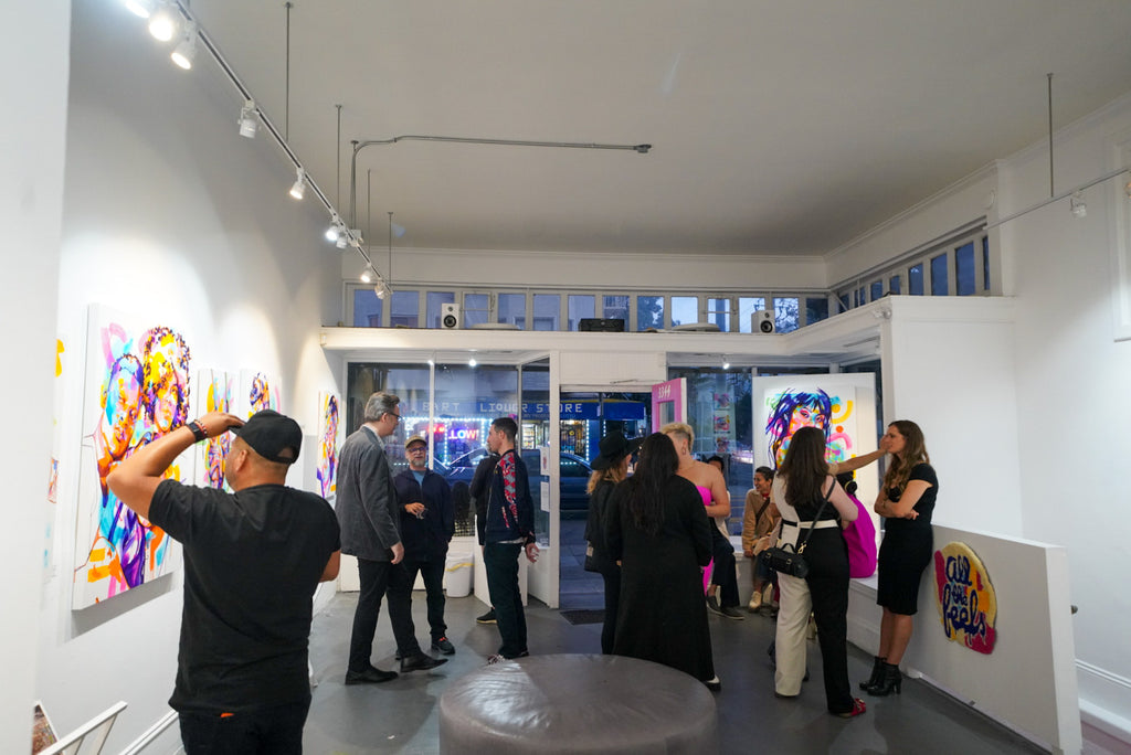 Photograph of gallery visitors viewing artwork during The Tracy Piper's "All the Feels" solo exhibition opening reception at Voss Gallery, San Francisco, August 25, 2023.