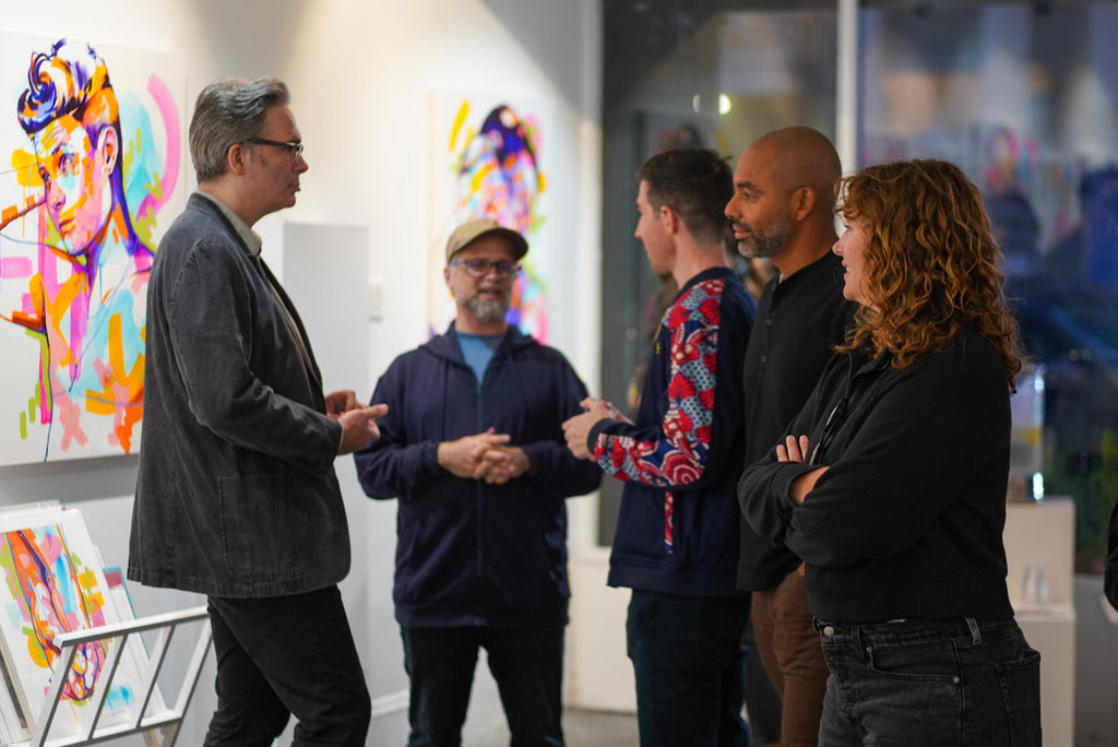 Photograph of people discussing during The Tracy Piper's "All the Feels" solo exhibition opening reception at Voss Gallery, San Francisco, August 25, 2023.