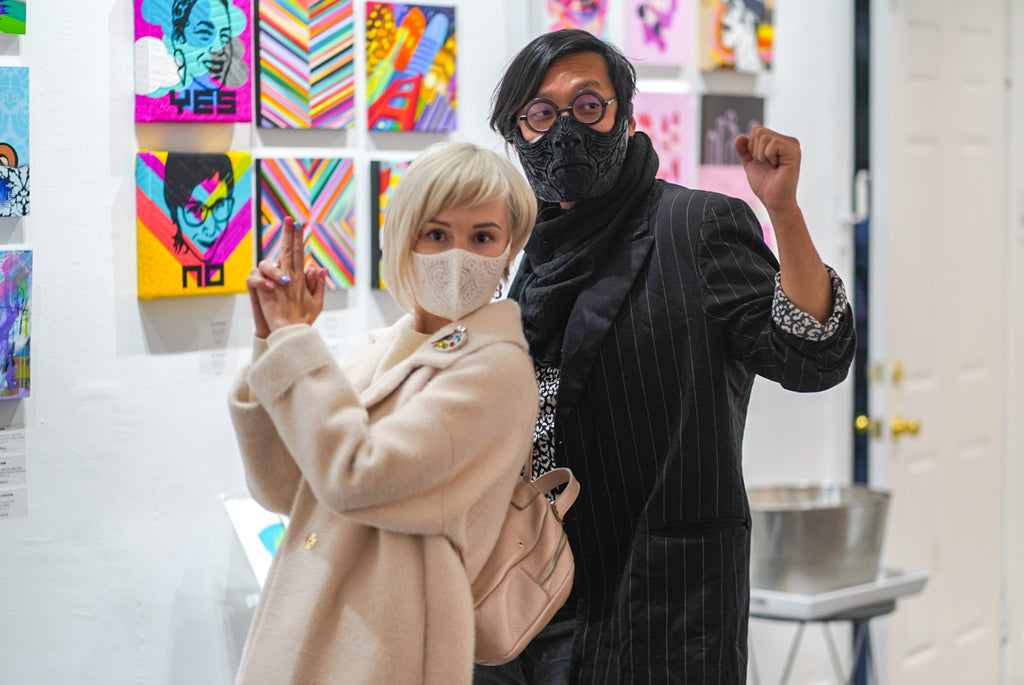 Photograph of two people during the "It's BASL, Baby!" group exhibition VIP Young Collectors Event at Voss Gallery, San Francisco, December 4, 2020.