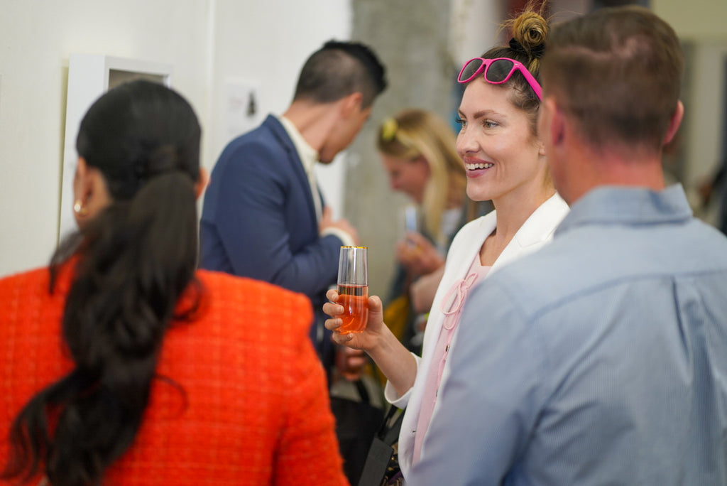 Photograph of artists and guests during the 'Art Unveiled: Collectors Mixer' at Voss Collector Club's visit to 1890 Bryant Studios, San Francisco, on March 10th, 2024.