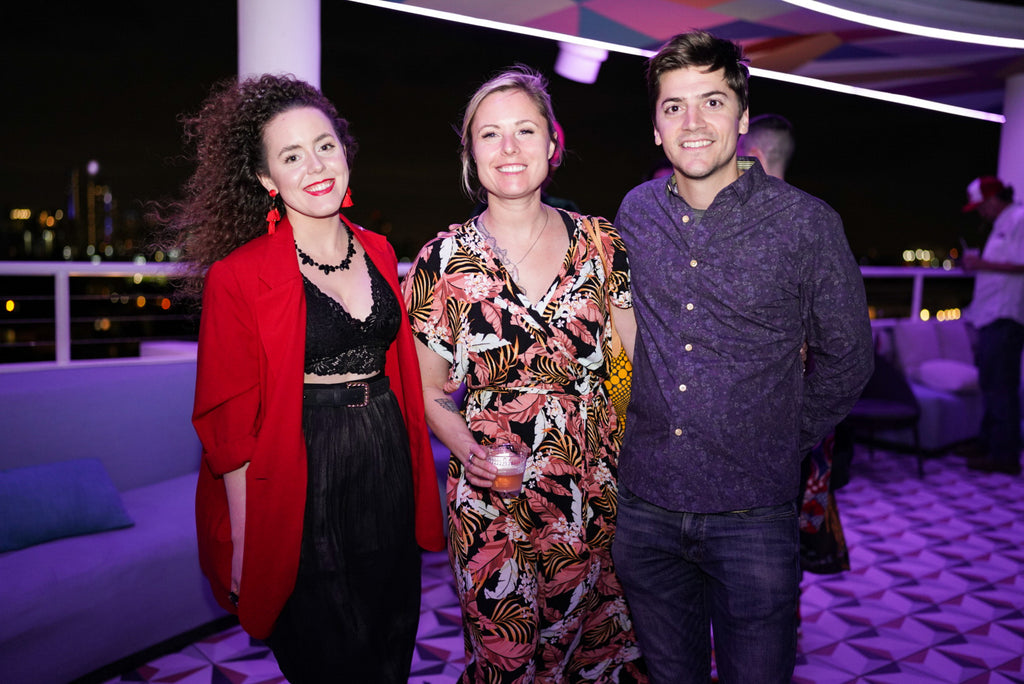 Photograph of Voss Gallery owner, Ashley Voss, and two guests during the Moxy Afterparty Art Basel Event in Miami Beach, December 2023.