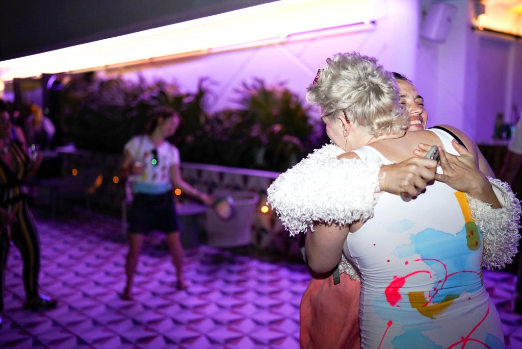 Photograph of two ladies hugging during the Moxy Afterparty Art Basel Event in Miami Beach, December 2023.