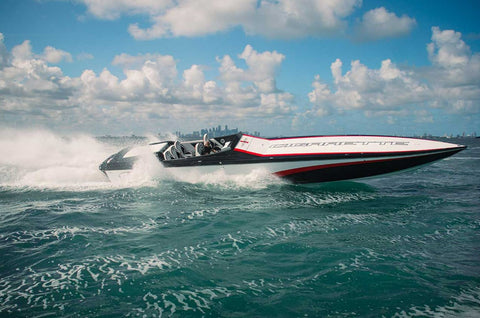Cigarette Boat Racing through for a water rescue demonstration 