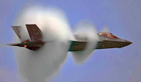 Doughnut Ring of Smoke on Military Jet Plane 