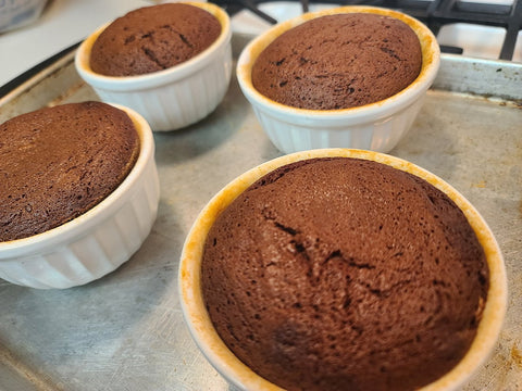 Baked molten lava cakes should just start to crack on top and still be jiggly in the centers.