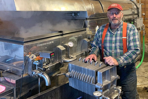 Daniel Fortin boiling maple syrup during the 2021 season at the Carman Brook Farm.