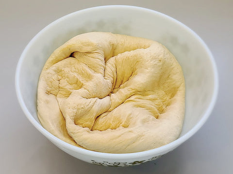 Dough that has been punched down and resting.