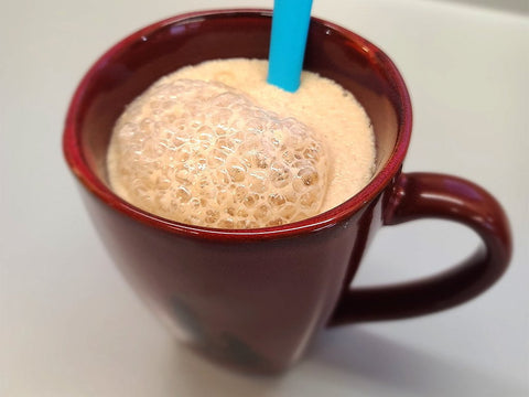 Yeast proofing in a coffee cup for my maple dinner rolls.