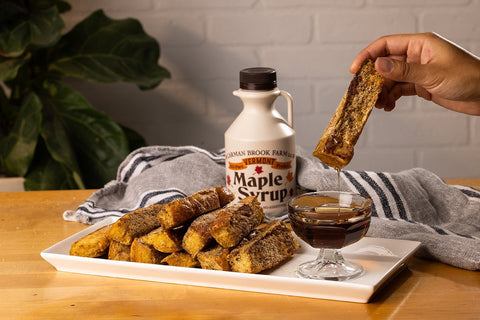 Gluten free French toast dipped into maple syrup is the perfect brunch treat.