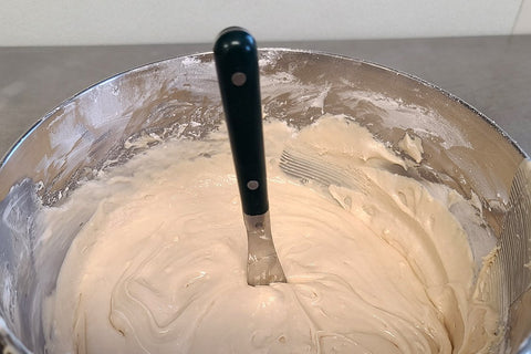 I want a knife to stand up in the middle of the frosting so I know that it is thick enough.
