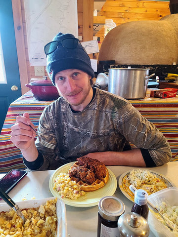 Levon showing us how to eat chicken and waffles at the sugarhouse.