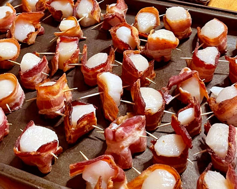 Secure your bacon wrapped scallops with a tooth pick and place on a baking sheet with a half inch between each.