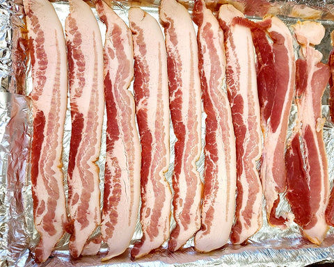 Par cooking bacon in the oven at 425F for 13 minutes.