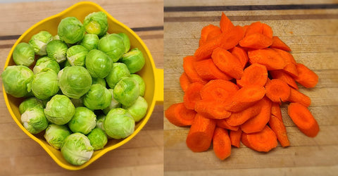 Bright green brussel sprouts and bright orange carrot slices.