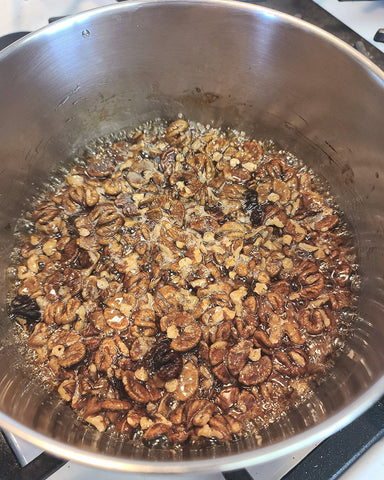 Hickory nuts getting coated in maple syrup.