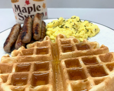 Have breakfast for dinner on a cold winter night. Belgian waffles with sausage and scrambled eggs, topped with maple syrup.