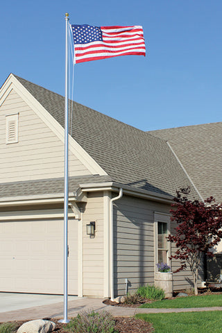 american flagpole display outside a house