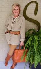 A woman holding a brown bag