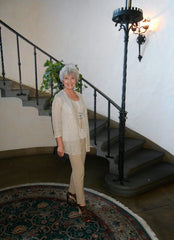 A woman standing in front of a stairs