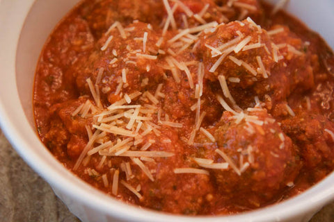 Meatballs with cheese on top