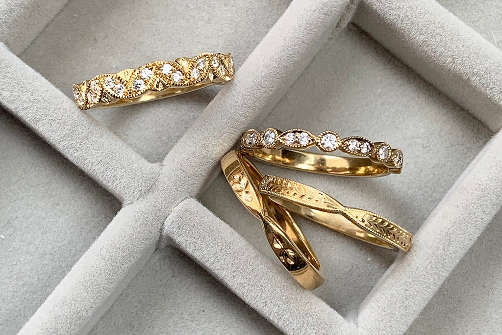 The Amare Collection of delicate vintage-inspired wedding bands, characterised by scalloped edges, milgrain beading and marquise diamonds