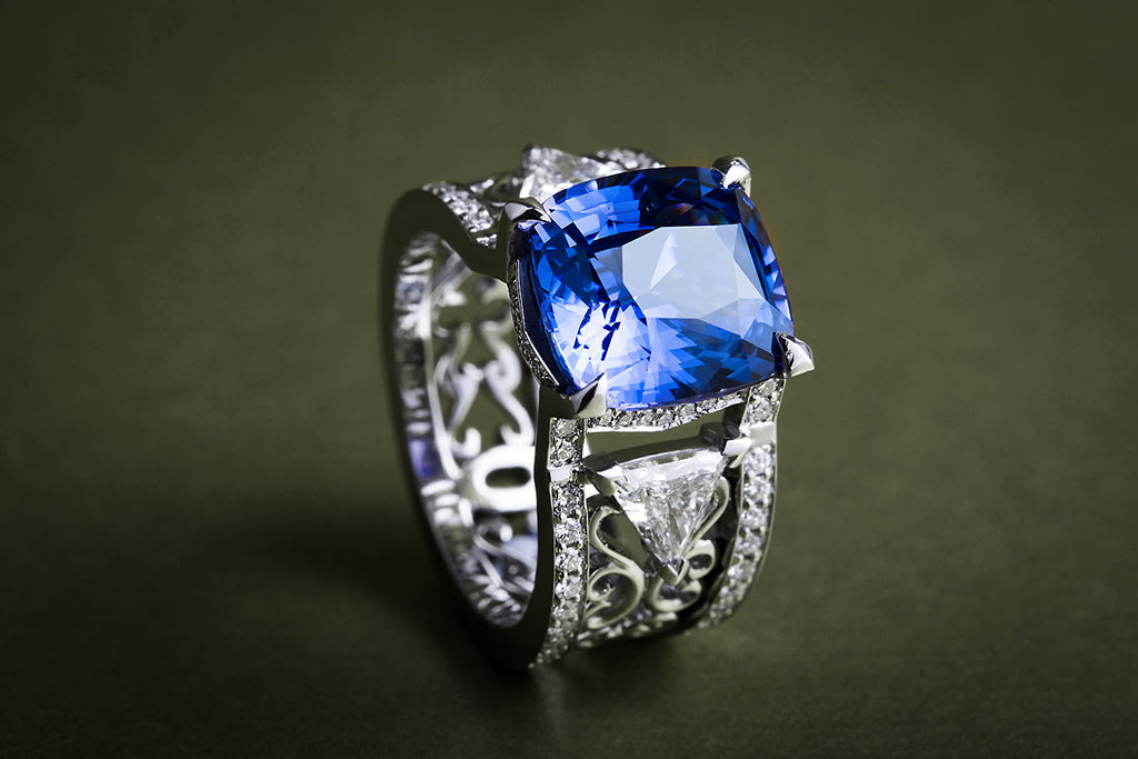 Damir's bespoke engagement ring, crafted in platinum using filigree-inspired techniques, conflict-free natural diamonds and a traceable fair-traded cushion-cut sapphire