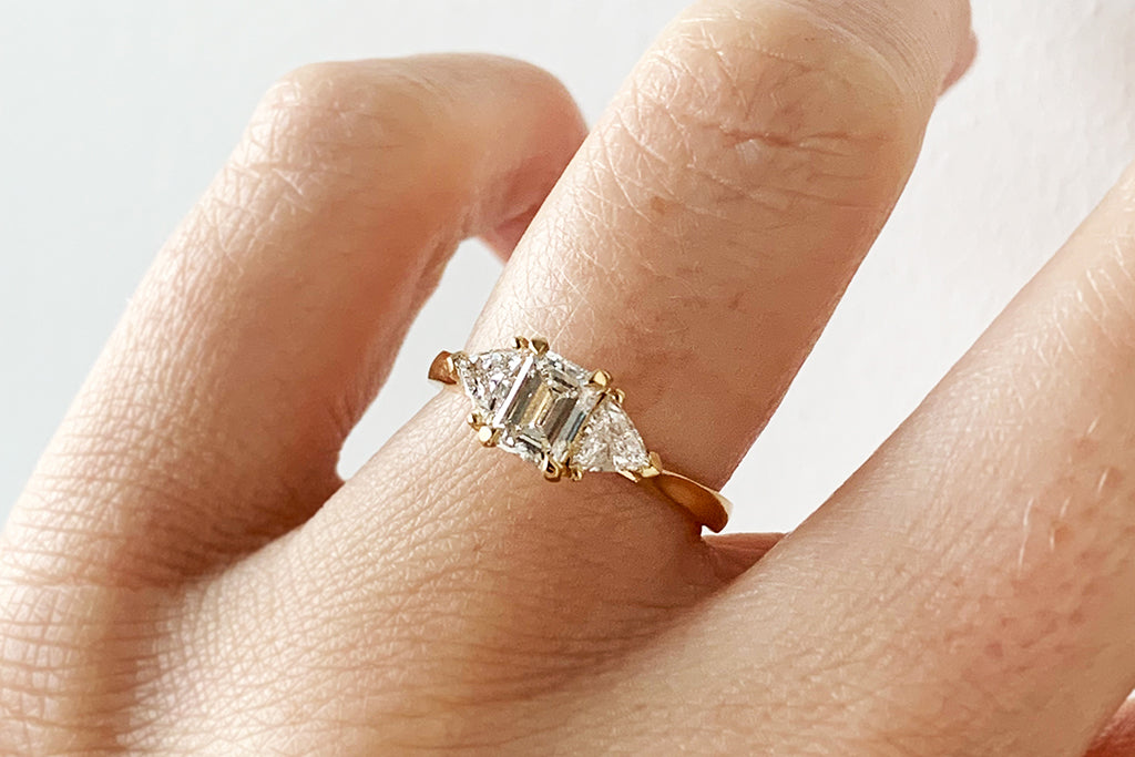 Steve's bespoke trilogy engagement ring, crafted in the UK using traceable Fairmined Eco Gold and a trilogy of conflict-free artisanal diamonds