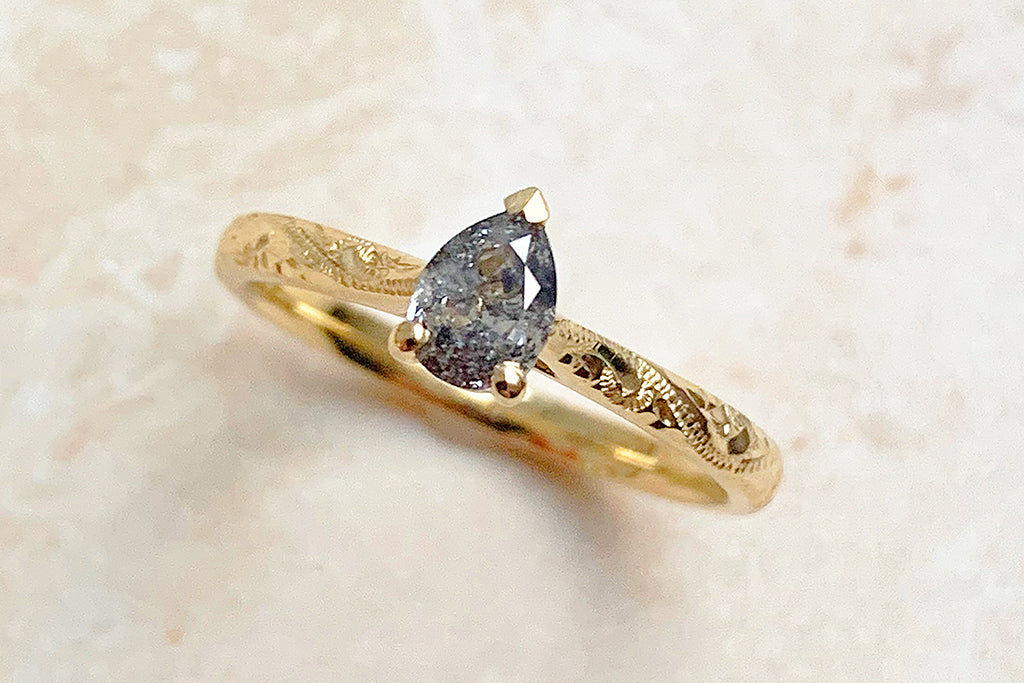 Fancy Athena 0.43ct pear cut salt and pepper diamond ethical gold engagement ring lifestyle FOR BLOG POST 7025006f 8c5e 45fa 96f9