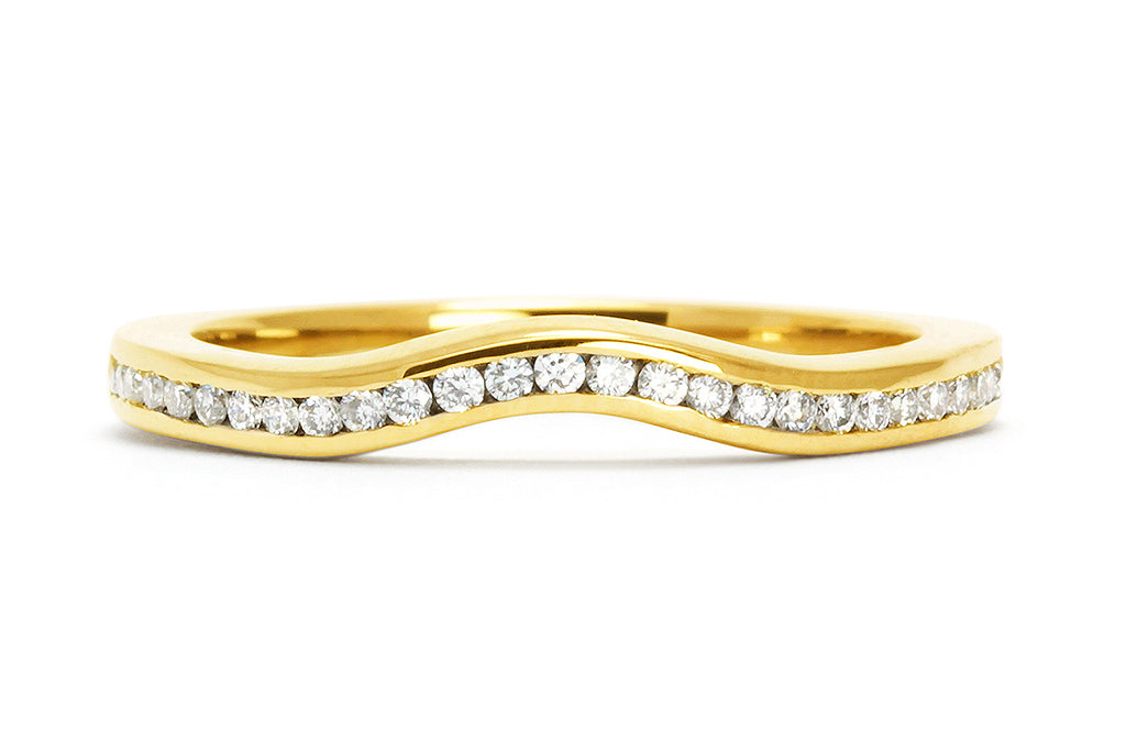 Our channel-set Accademia shaped wedding band with conflict-free diamonds and eco gold band