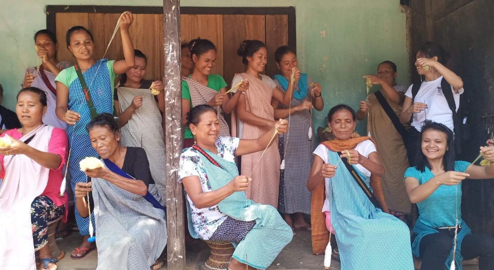 Women spinners from Diwon spinning with Eri silk on world wide spin in public day | Muezart