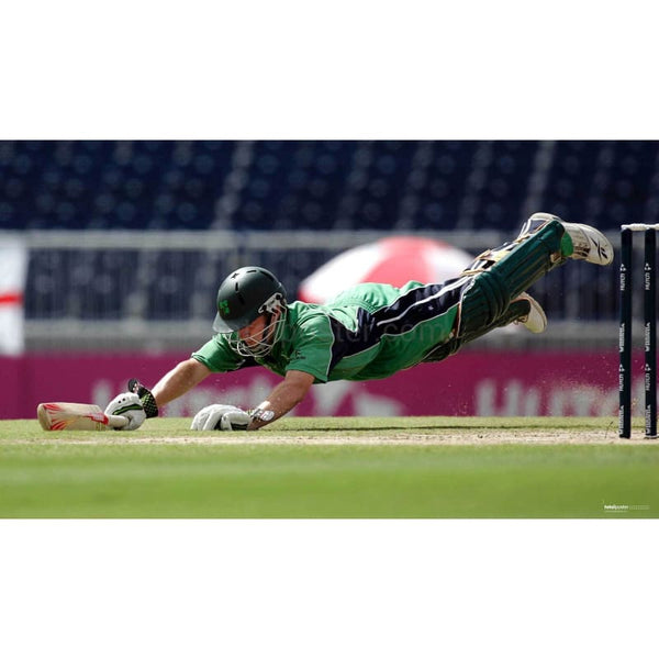 reland`s William Porterfield dives to the crease to avoid being run out during their World Cup cricket Super Eights match against Bangladesh in Bridgetown | TotalPoster