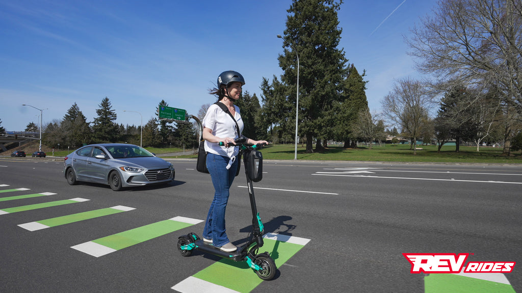 Riding Electric scooter commuting in town