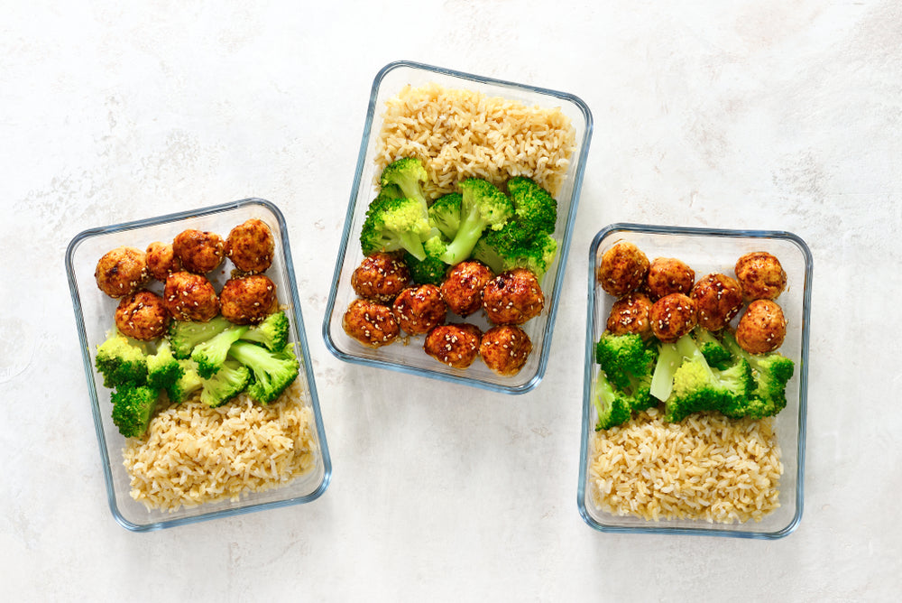 Meal prep containers and portioned meals