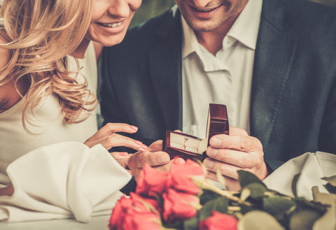 Couple Admiring Engagement Ring