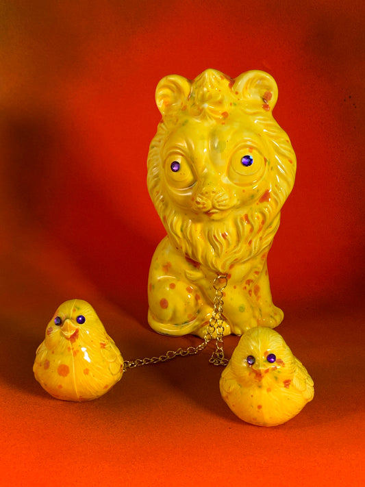 Yellow Lion Chained to Birds